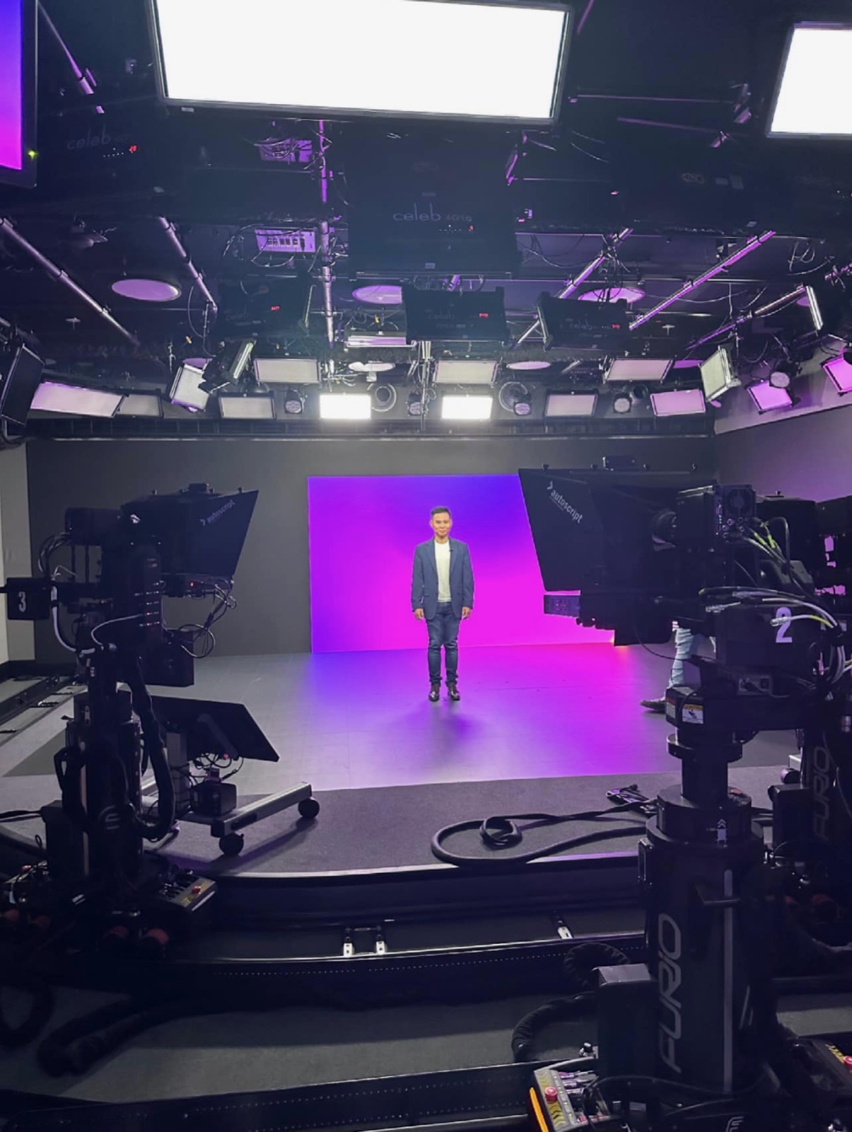 Chad presenting on a brightly lit studio set